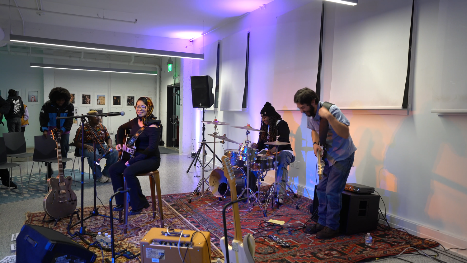 Musicians set up their instruments in the gallery.