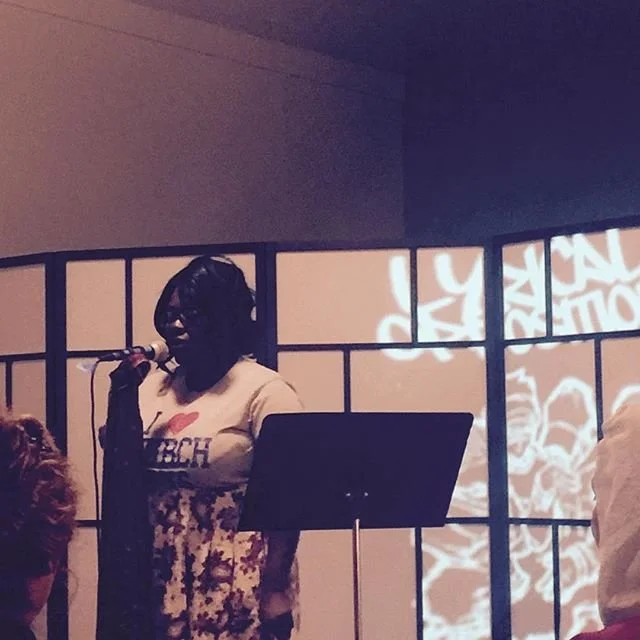 Close view of a performer at the microphone.