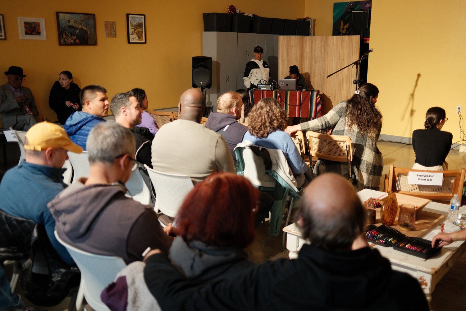 Audience members seated in rows during the open mic.