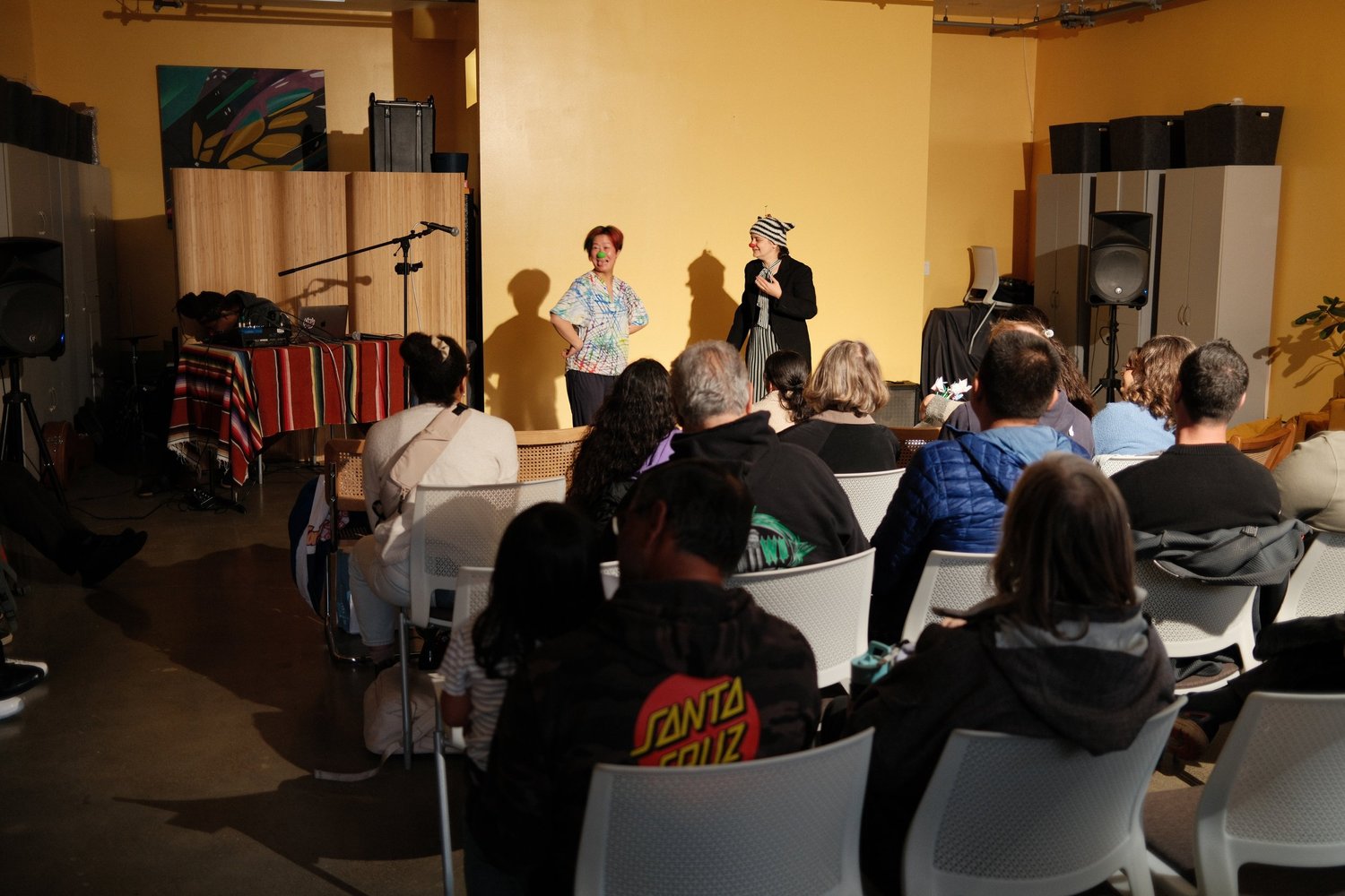 Audience listening to two presenters at the front.