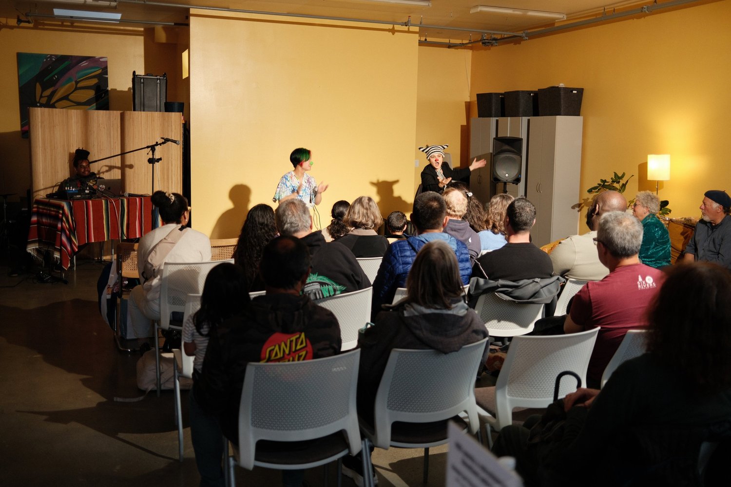 Audience watching a participant at the microphone.