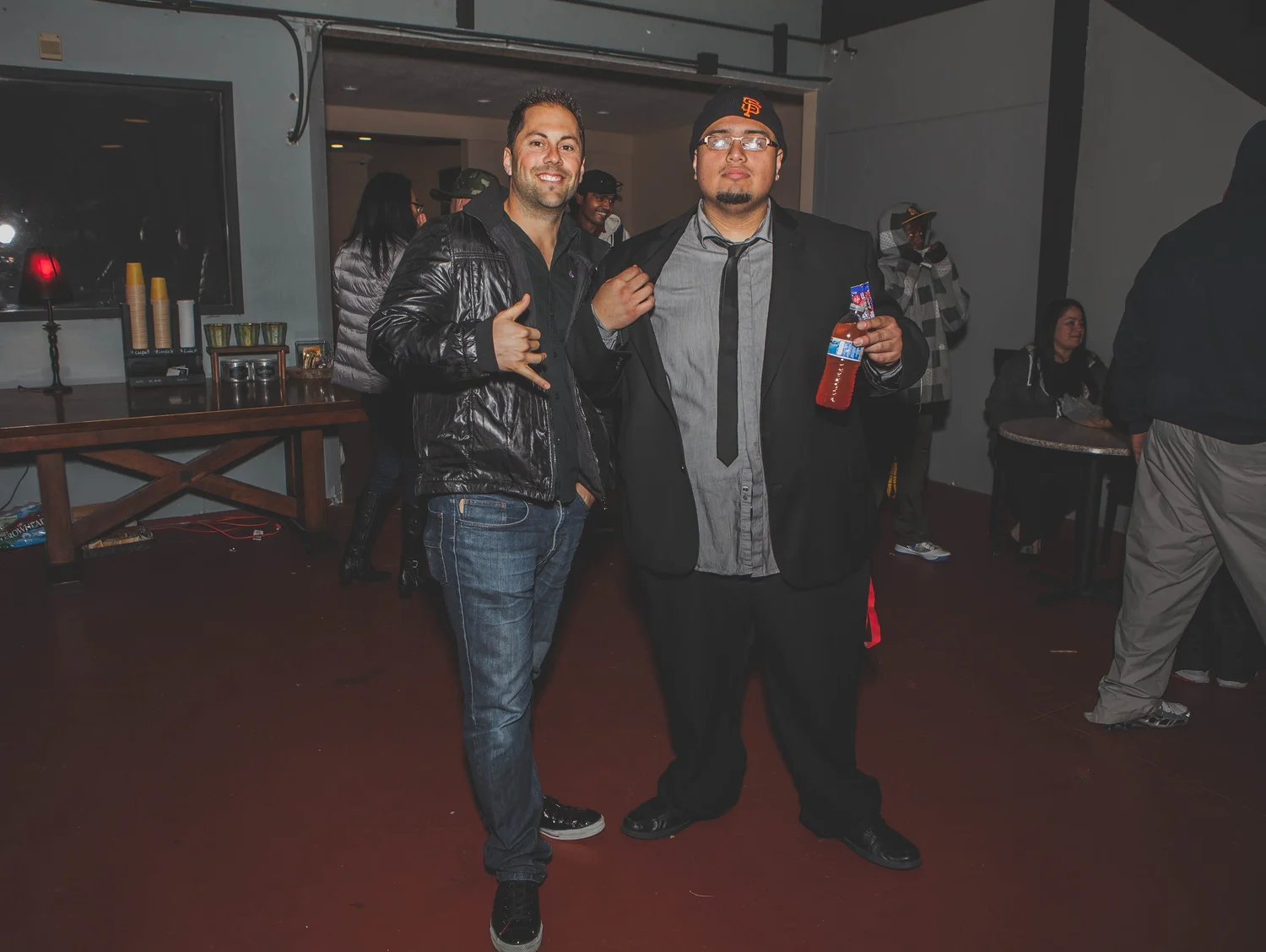 Two guests posing together in the venue.