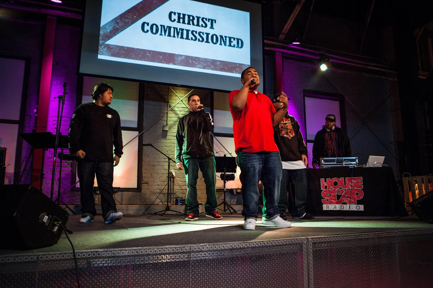 Group performing together across the stage.