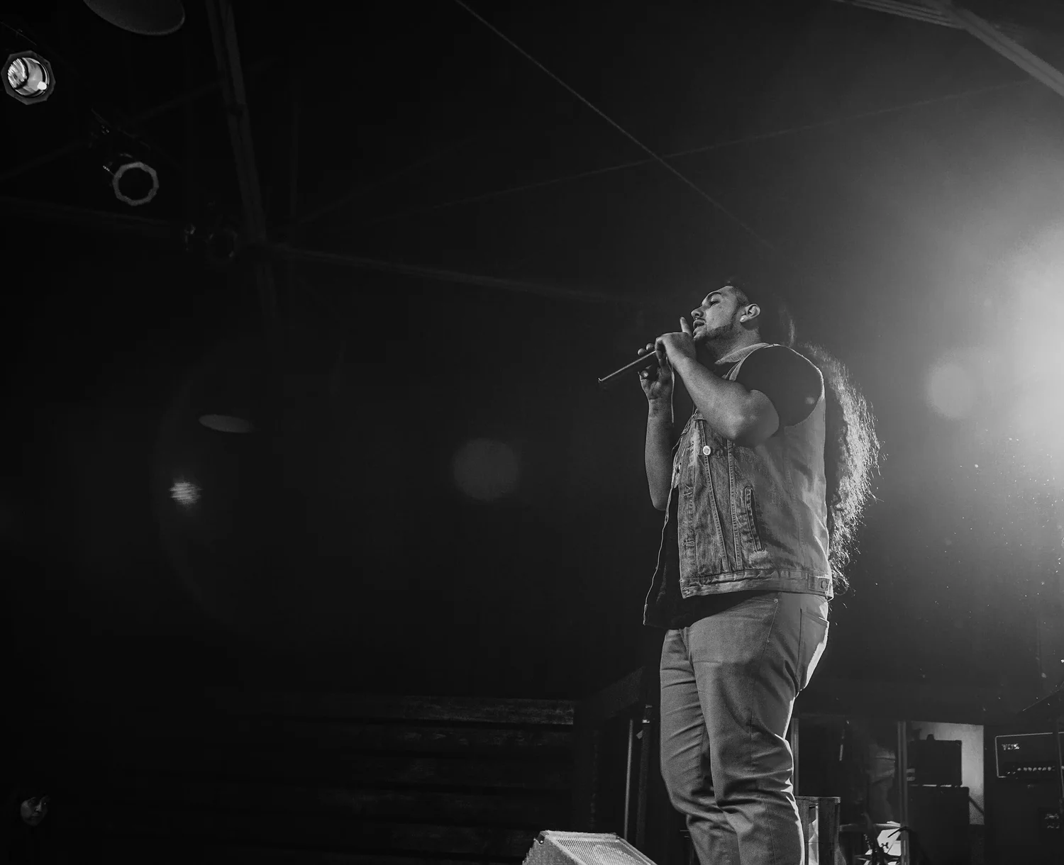 Black-and-white photo of a vocalist with long hair.