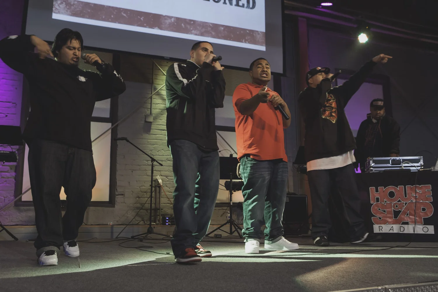 Group of vocalists performing together across the stage.