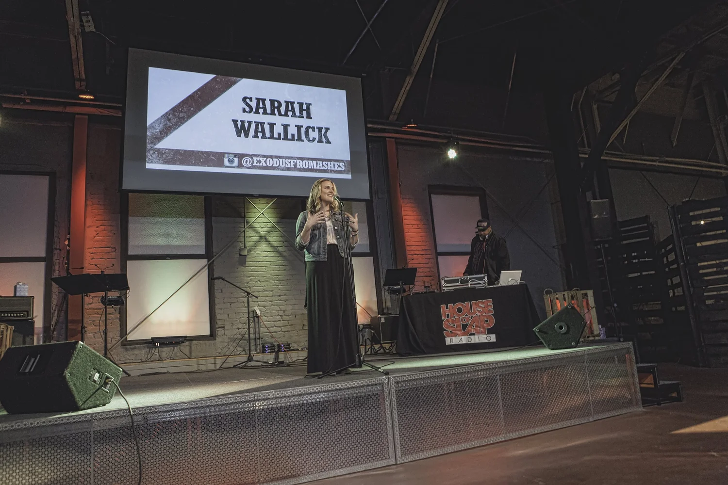 Wide view of a vocalist at the center microphone.
