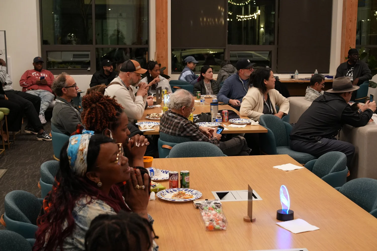 Community members sharing tables during the event.
