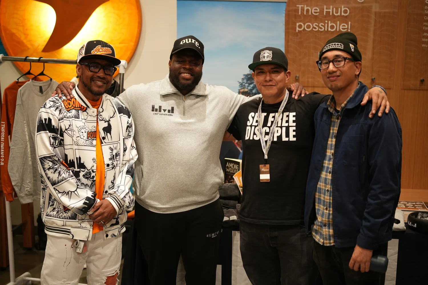 Four participants posing together at the community gathering.