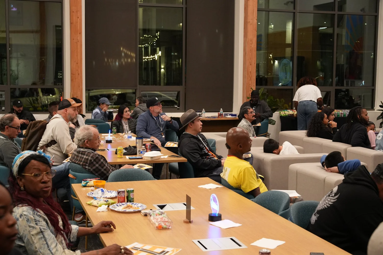 Guests sharing a meal in the community lounge.