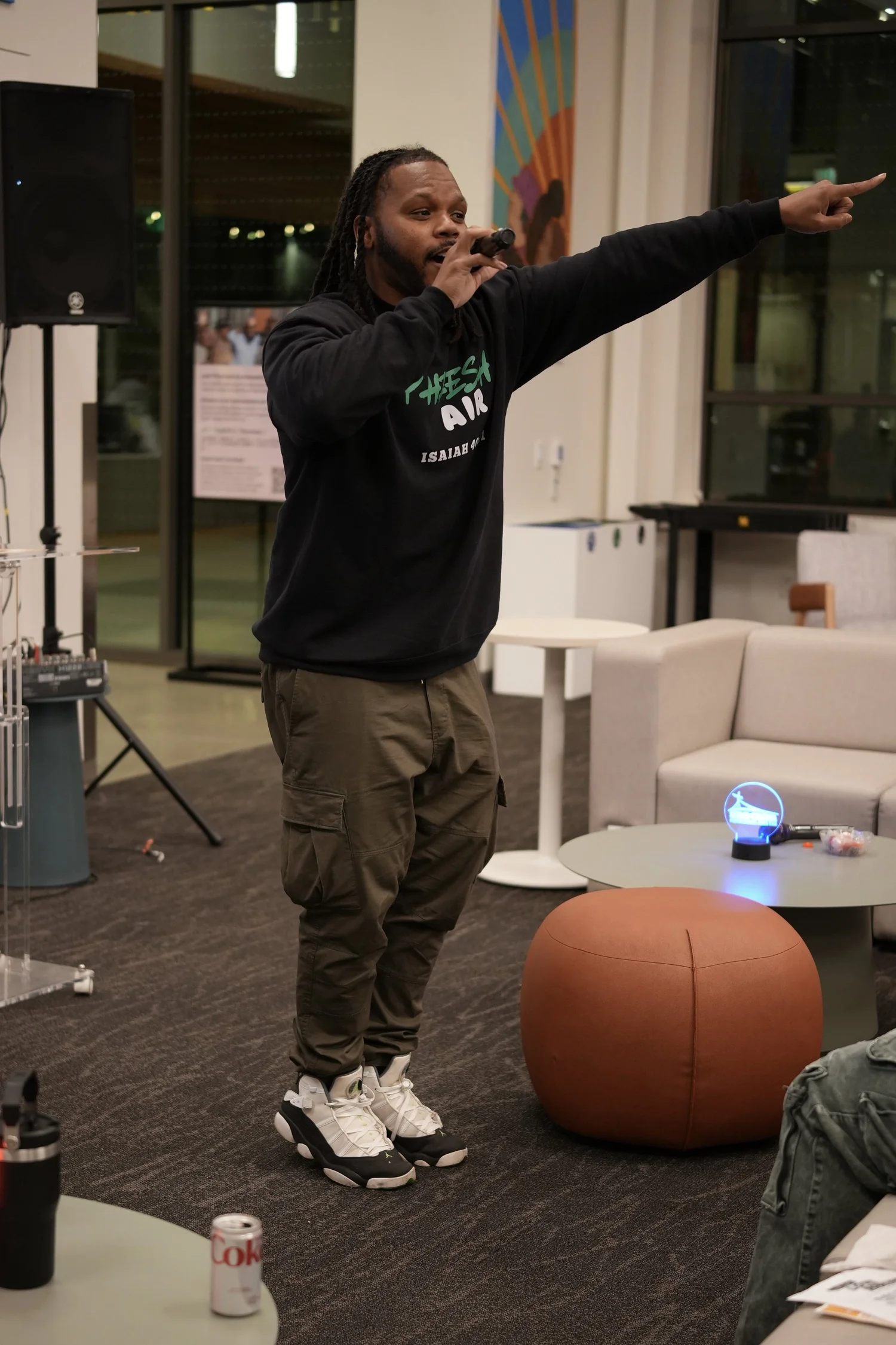 Performer pointing toward someone across the room.