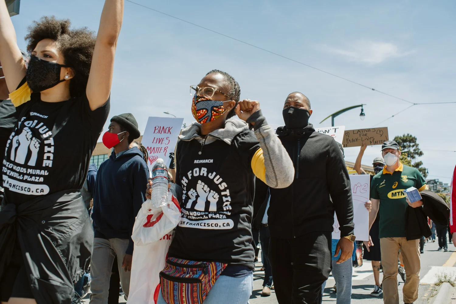 Participants raising their fists while walking.