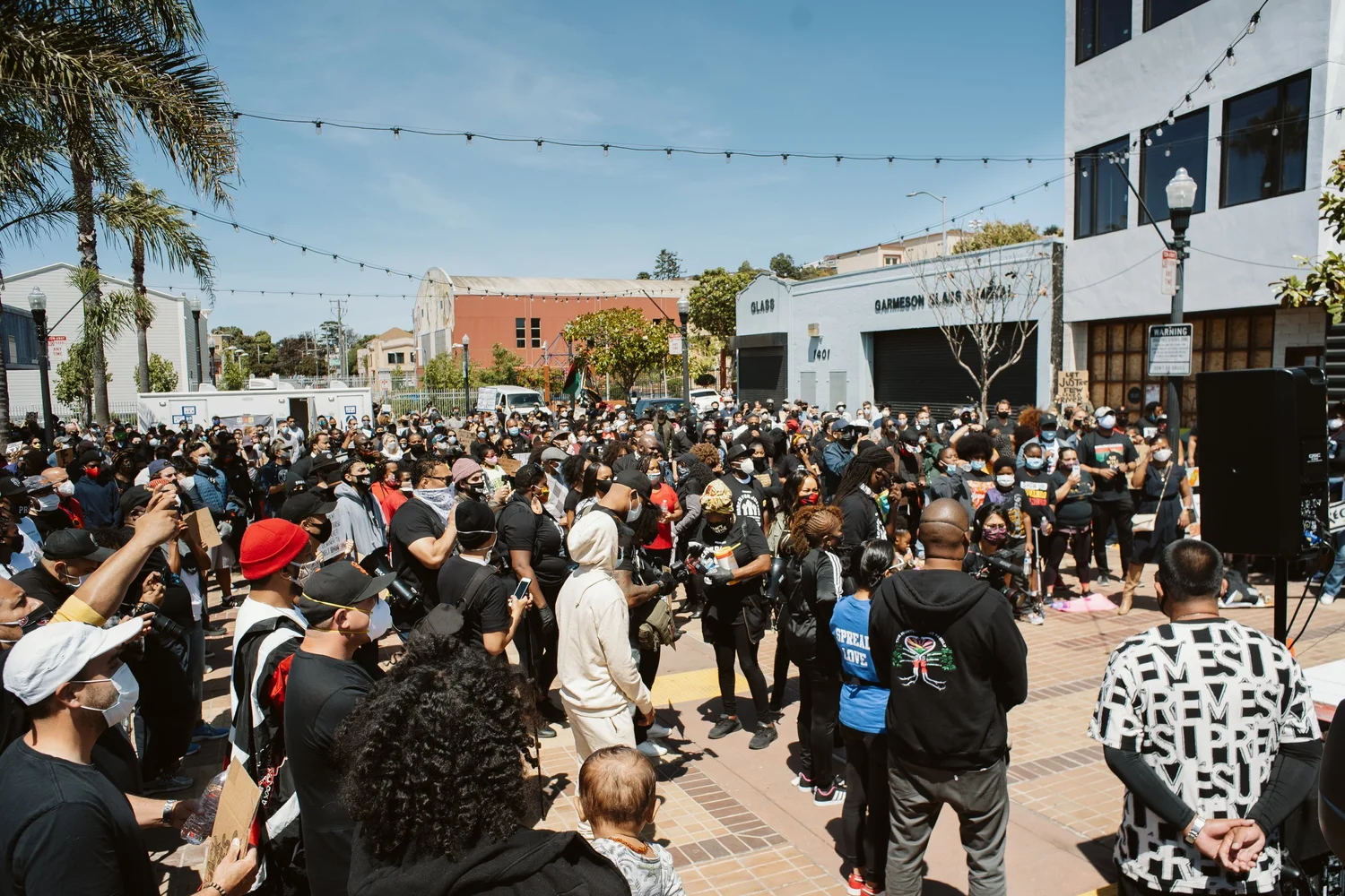 Elevated view of a large crowd gathered in the plaza.