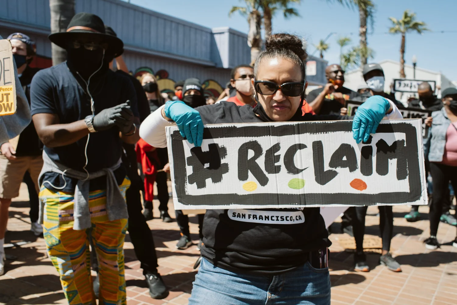 Participant displaying a Reclaim San Francisco sign.