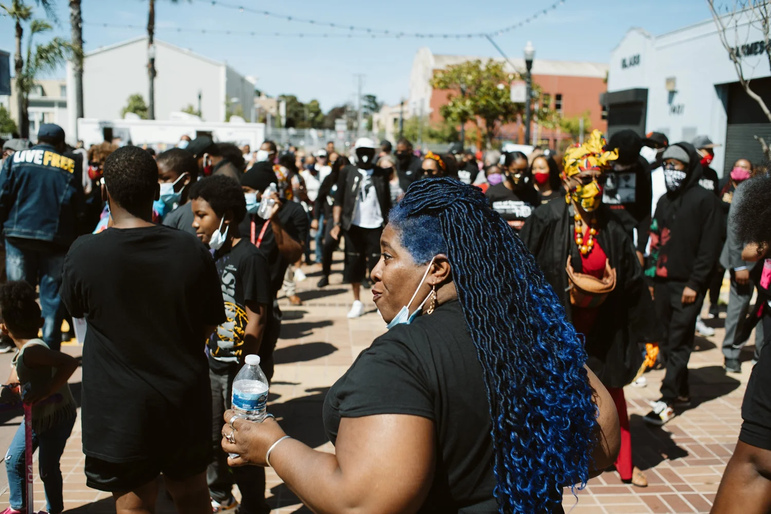 Participants turning toward one another in the crowd.