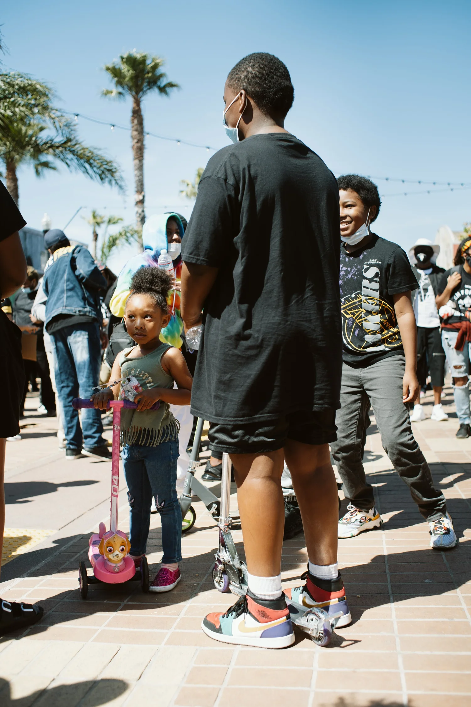 Children and adults gathered near the front of the rally.