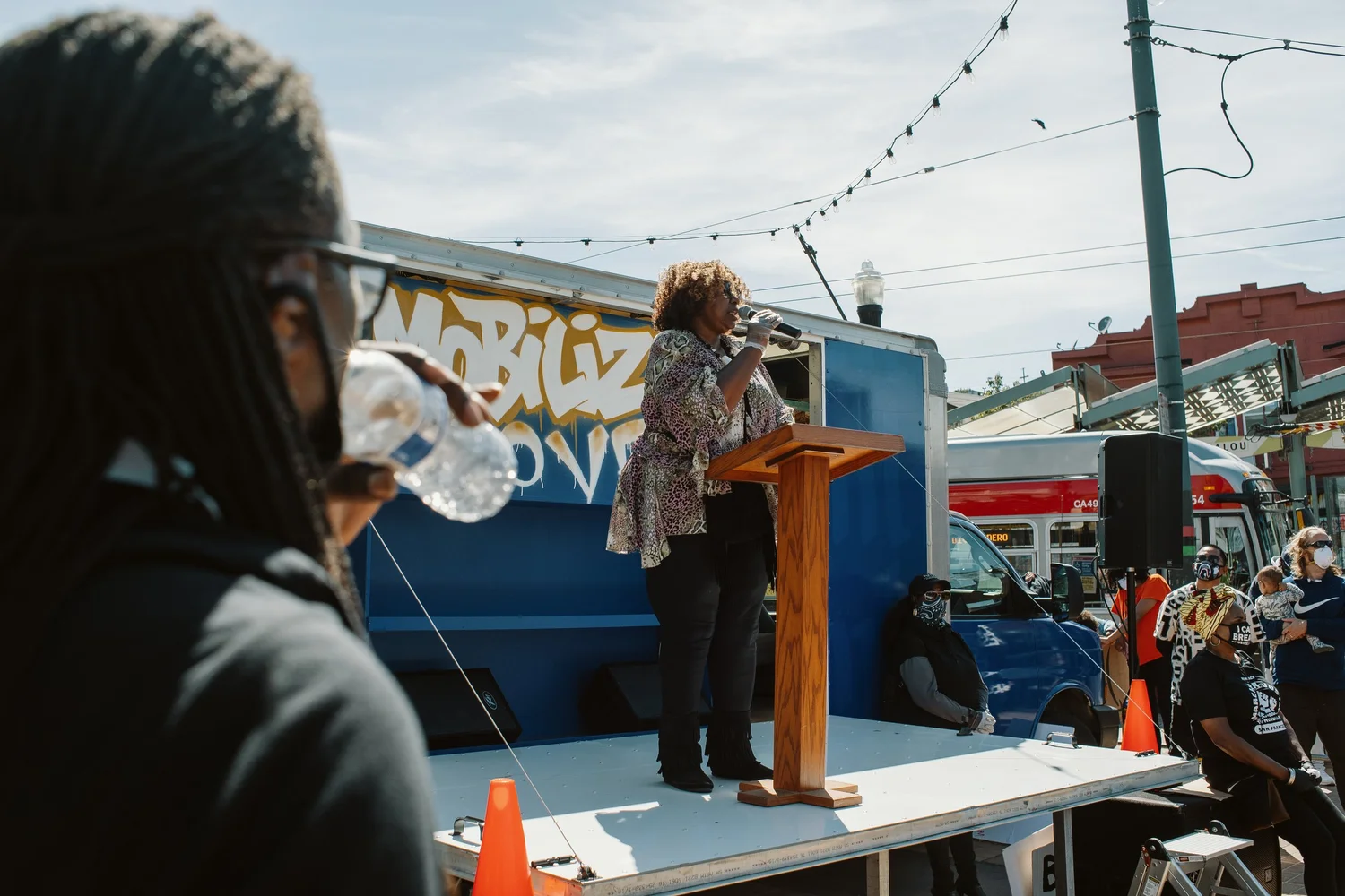 View past an audience member toward the lectern.