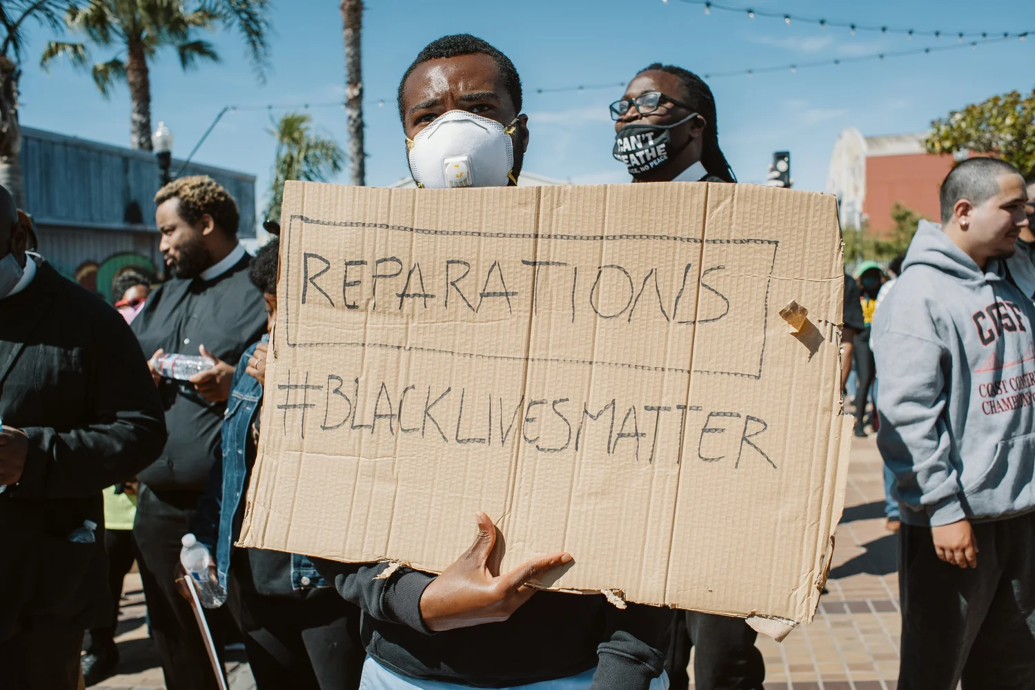 Close view of the handwritten Reparations sign.