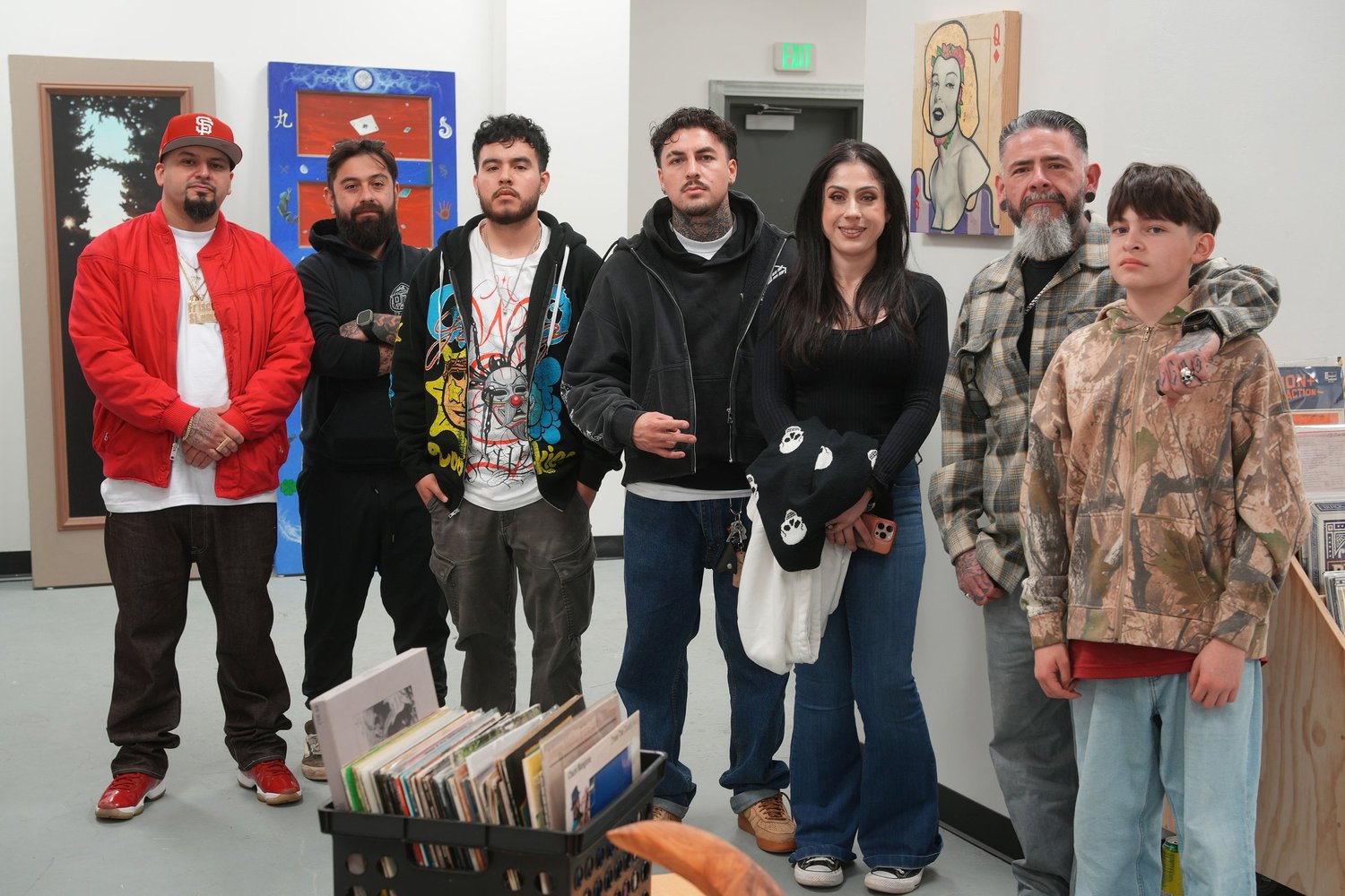 Group portrait of visitors beside the record collection.