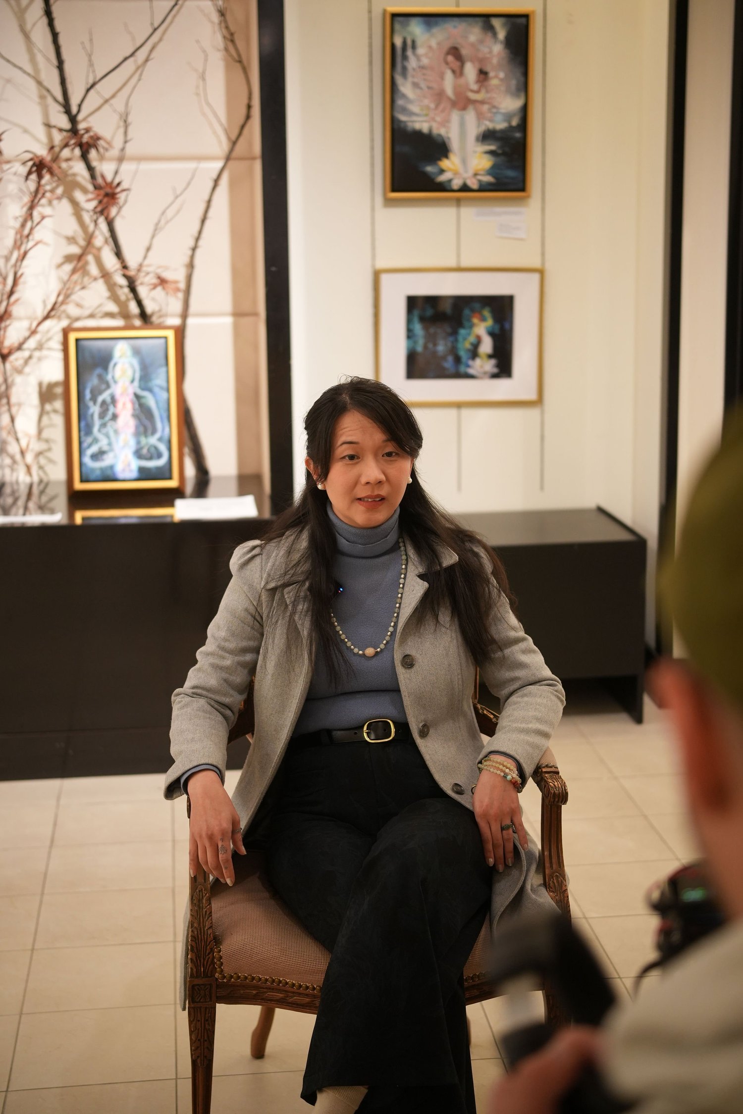 A participant sits for a recorded conversation.