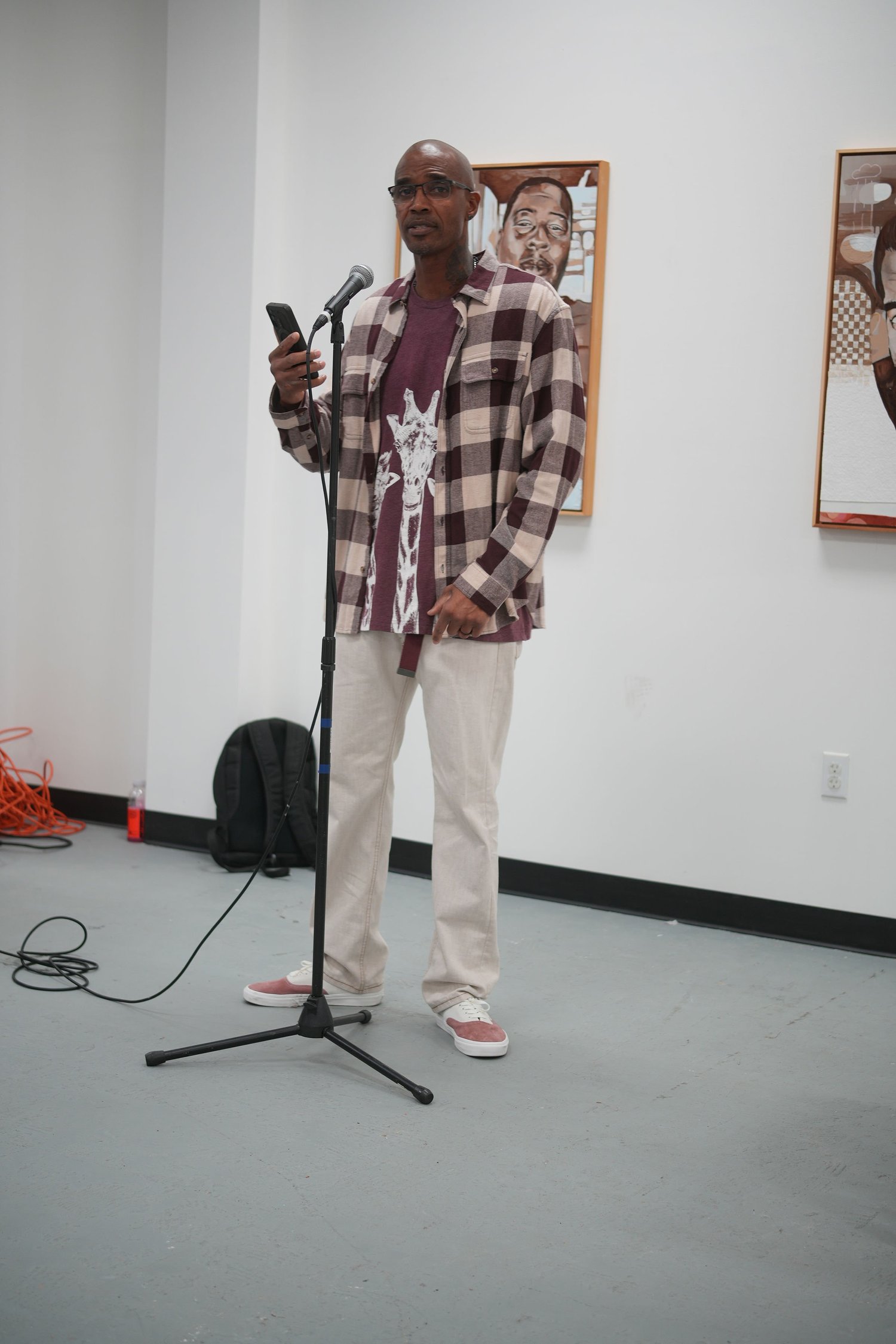 A participant speaks at a microphone.