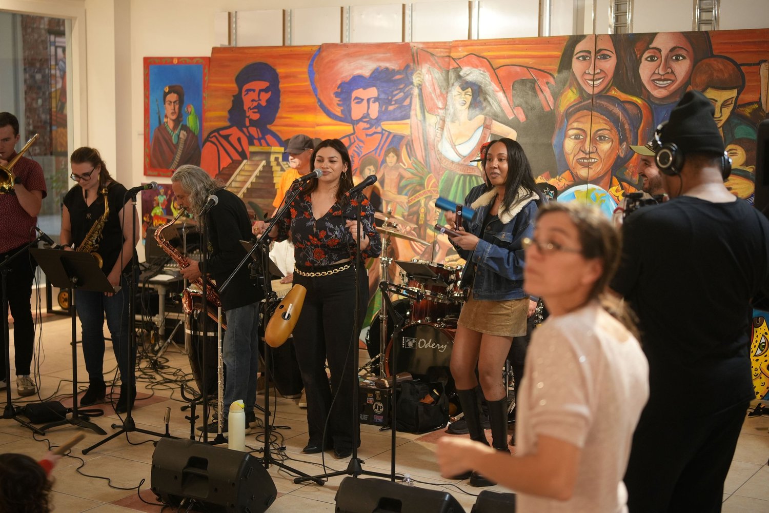 Vocalists and instrumentalists perform together.