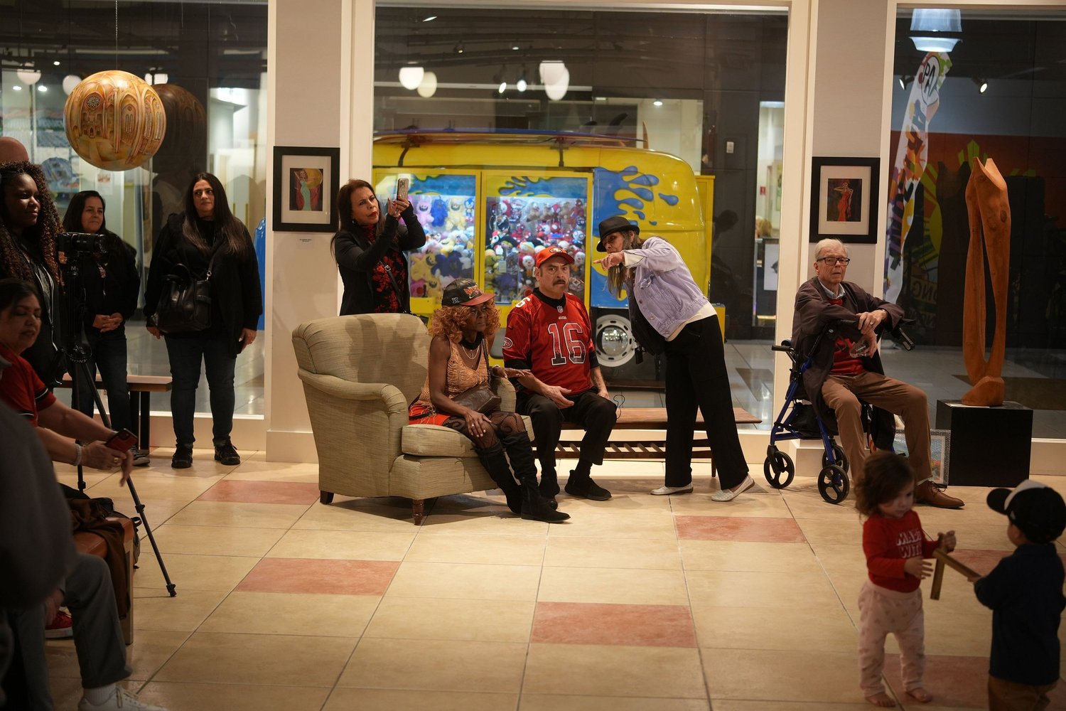 Guests socialize around the gallery seating.