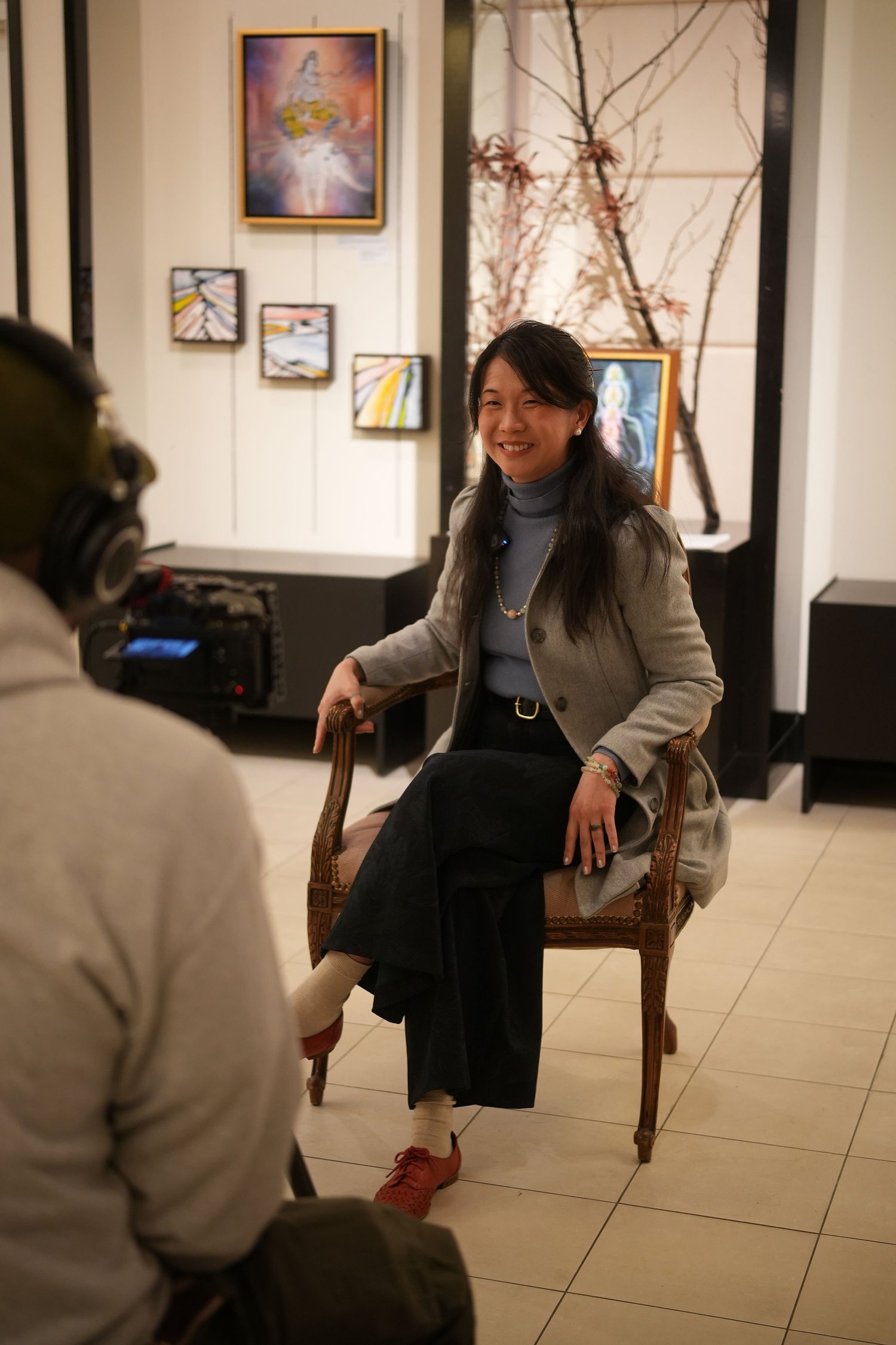 A seated guest talks during an interview.