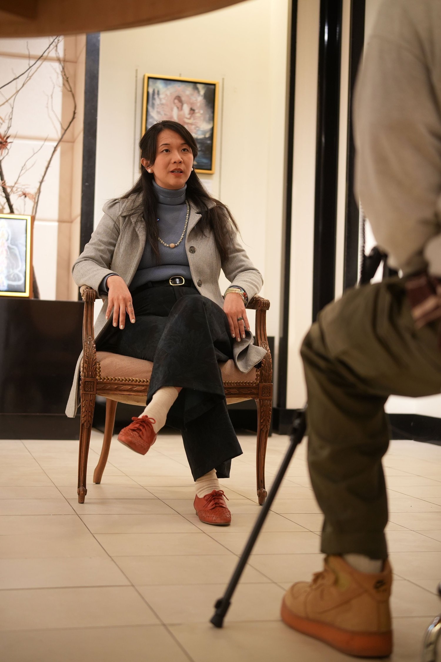 A participant speaks during a recorded conversation in the gallery.
