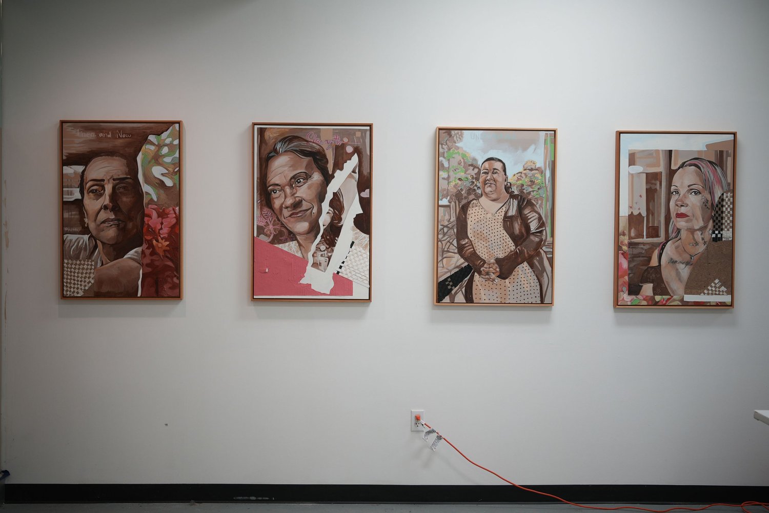 Framed painted portraits displayed in a row.