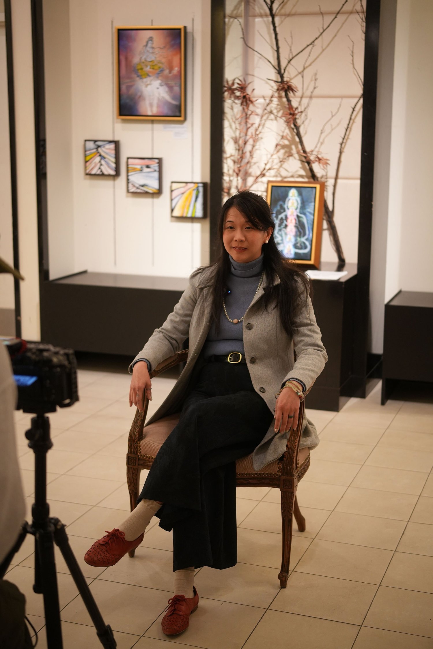 A participant speaks during a recorded conversation in the gallery.