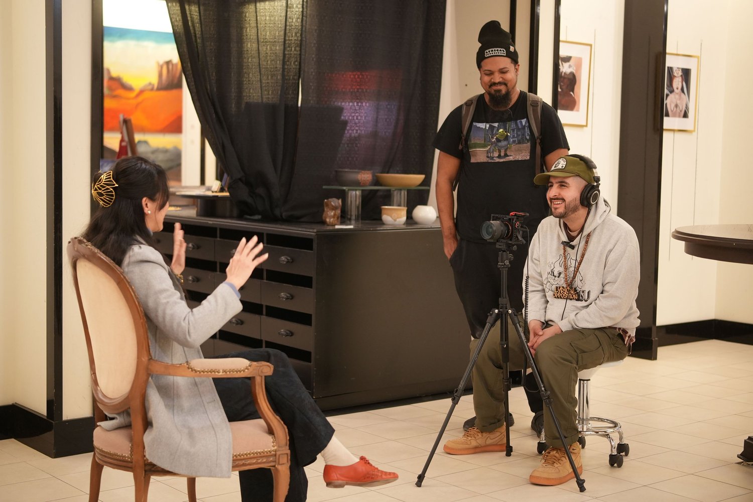 A participant speaks during a recorded conversation in the gallery.