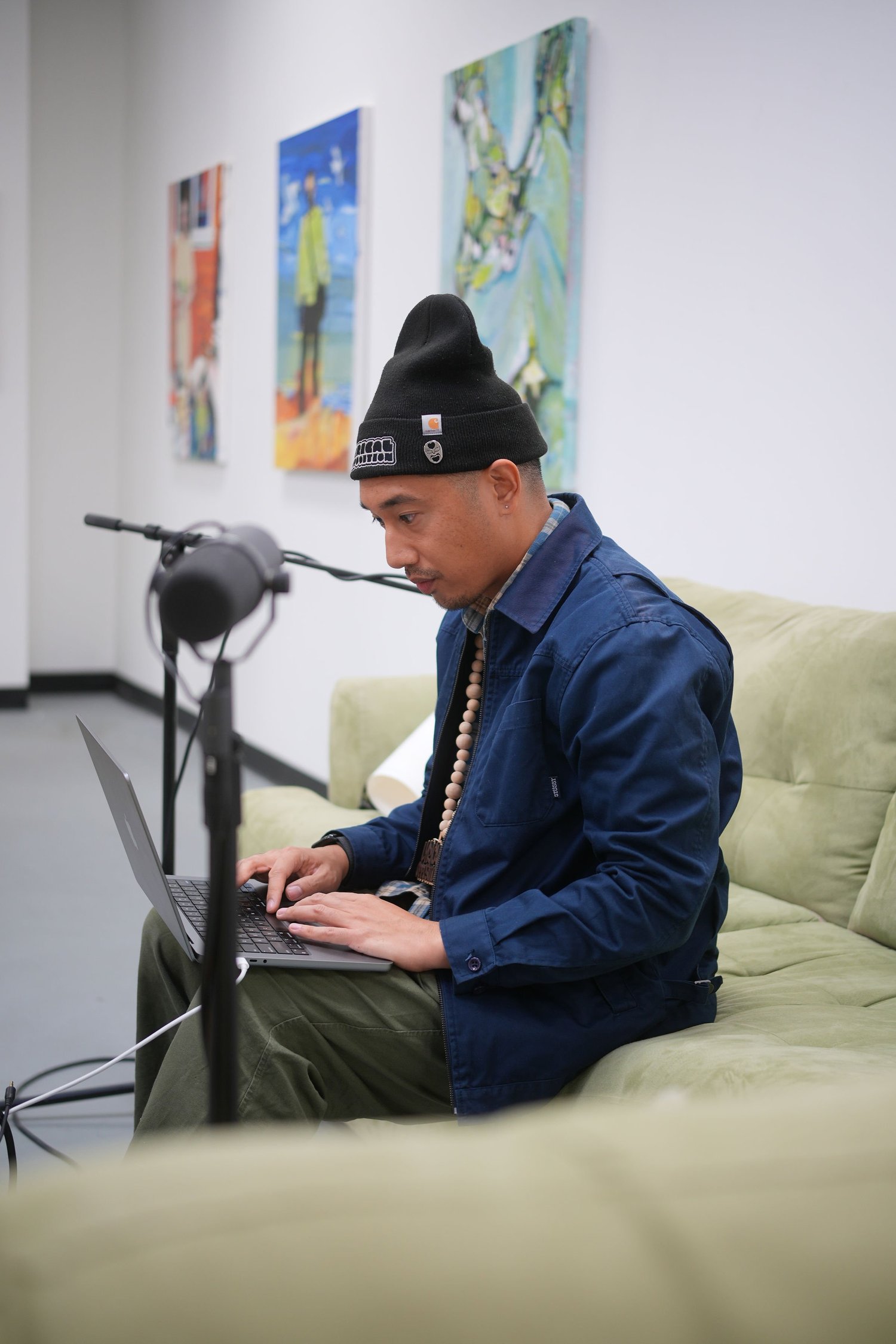 A participant speaks during a recorded conversation in the gallery.