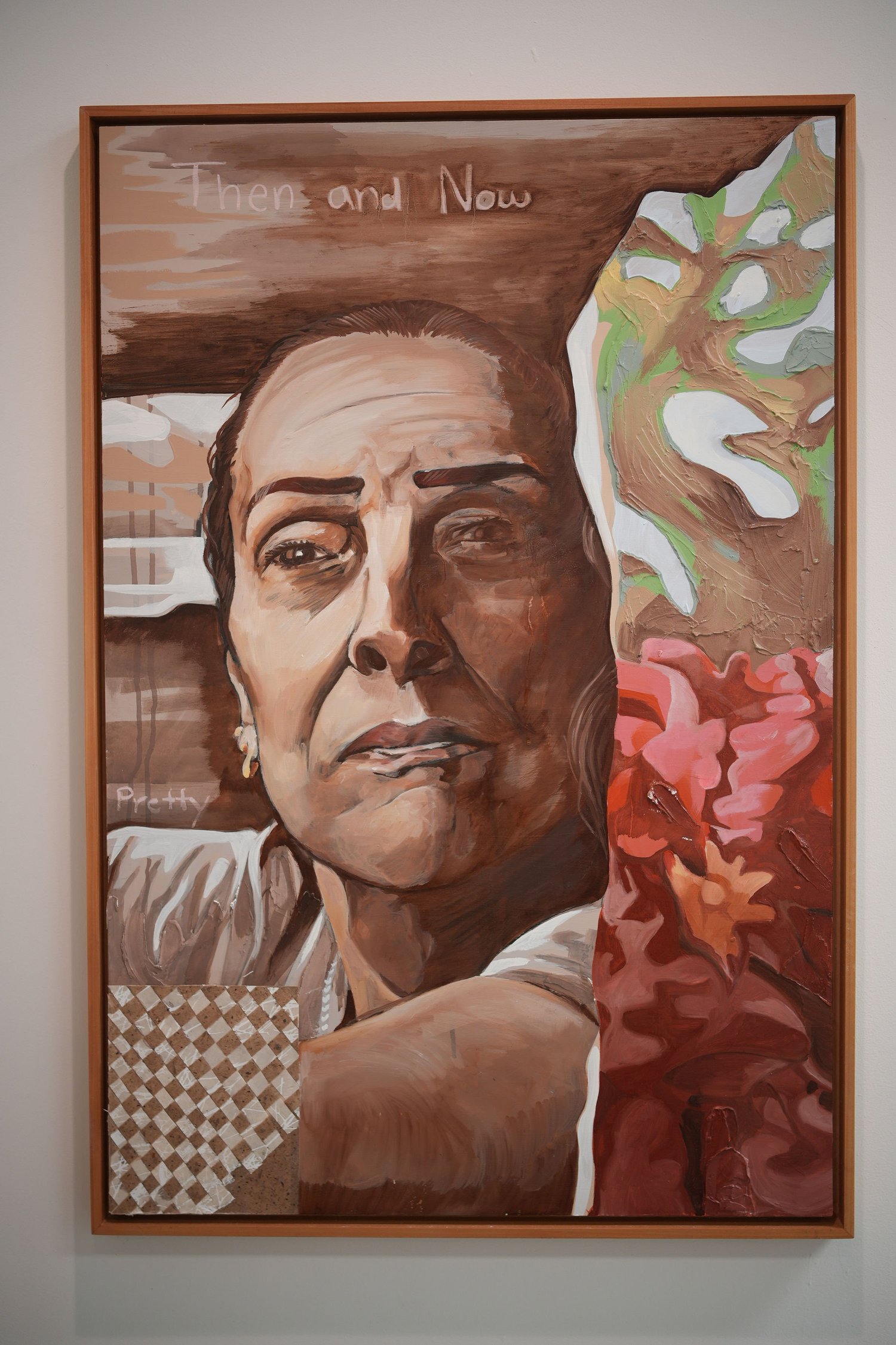A framed painted portrait with a thoughtful expression.