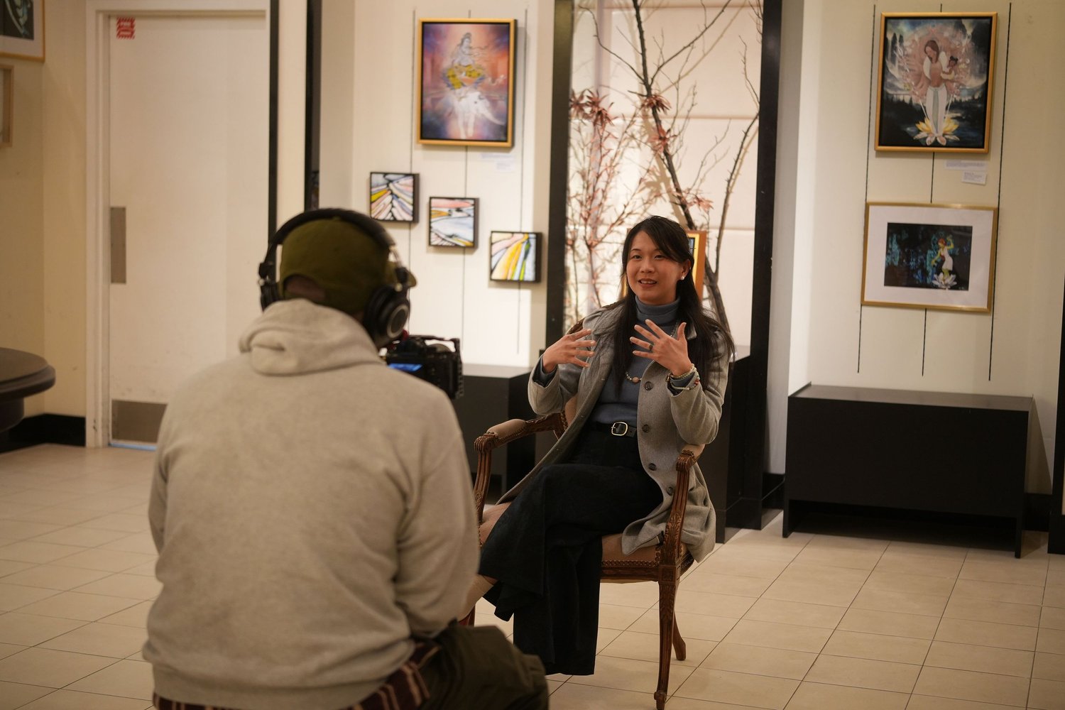 A participant speaks during a recorded conversation in the gallery.