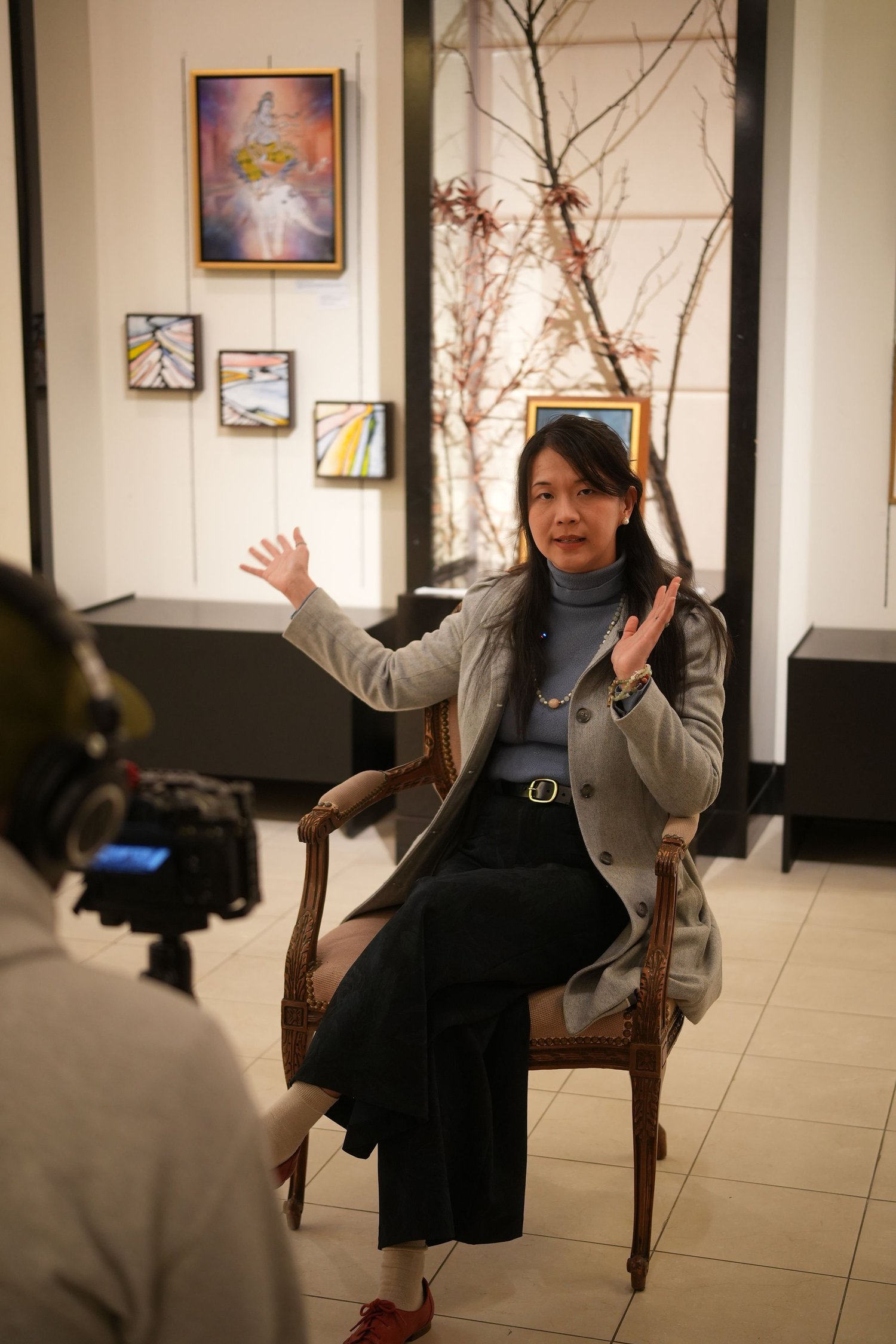 A participant speaks during a recorded conversation in the gallery.