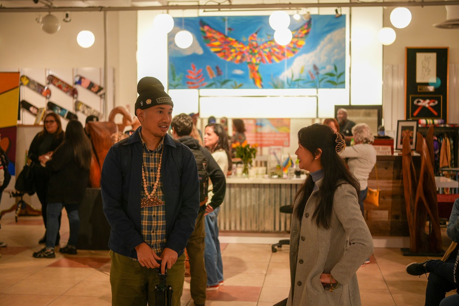 Visitors walk together through the exhibition.