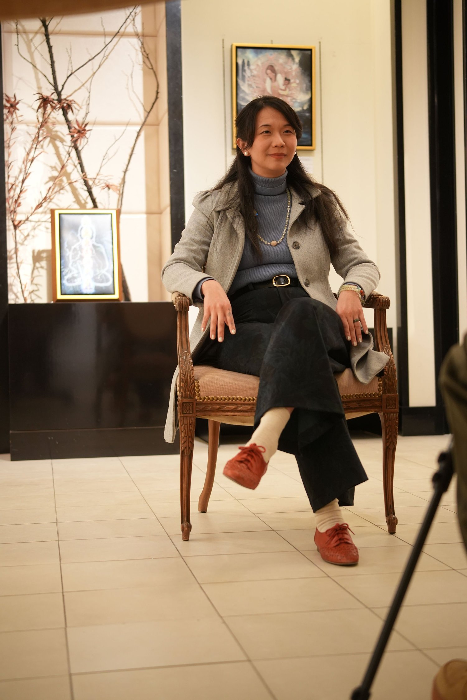 A participant speaks during a recorded conversation in the gallery.