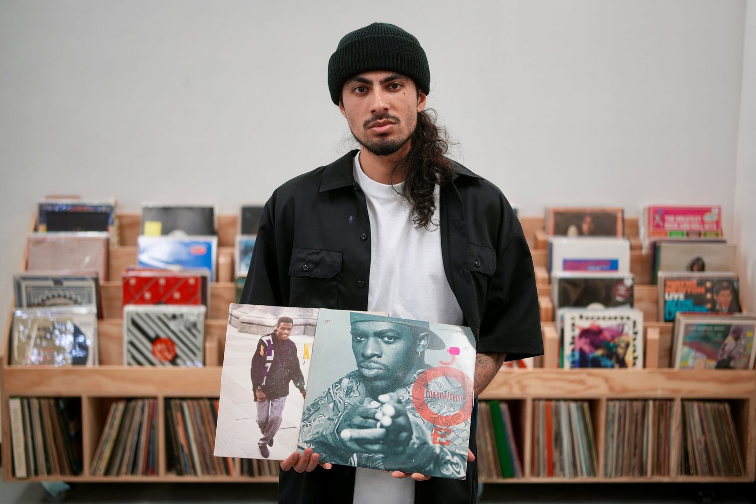 An artist displays vinyl record sleeves.