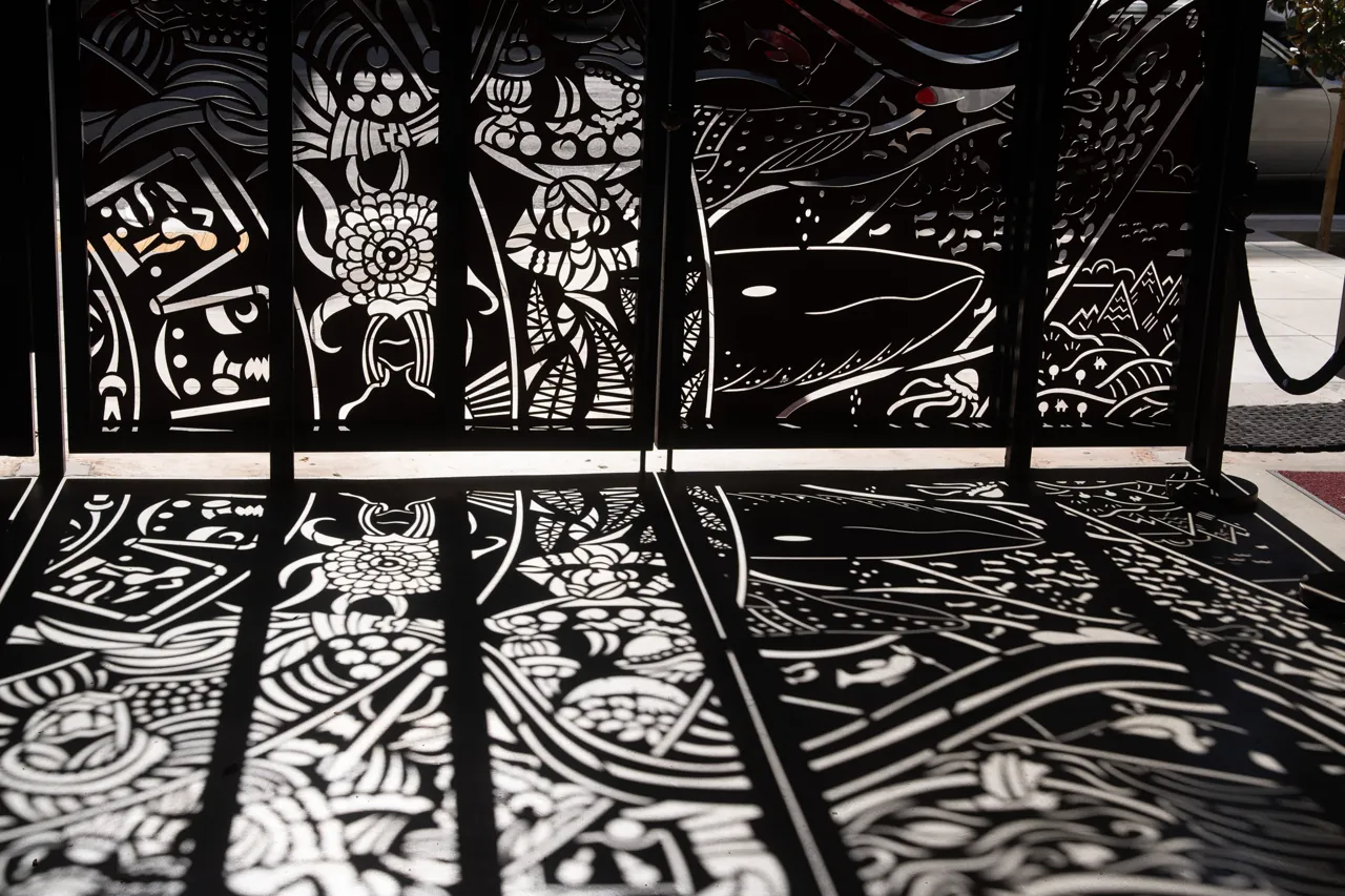 Black-and-white illustrated panels cover a display surface.