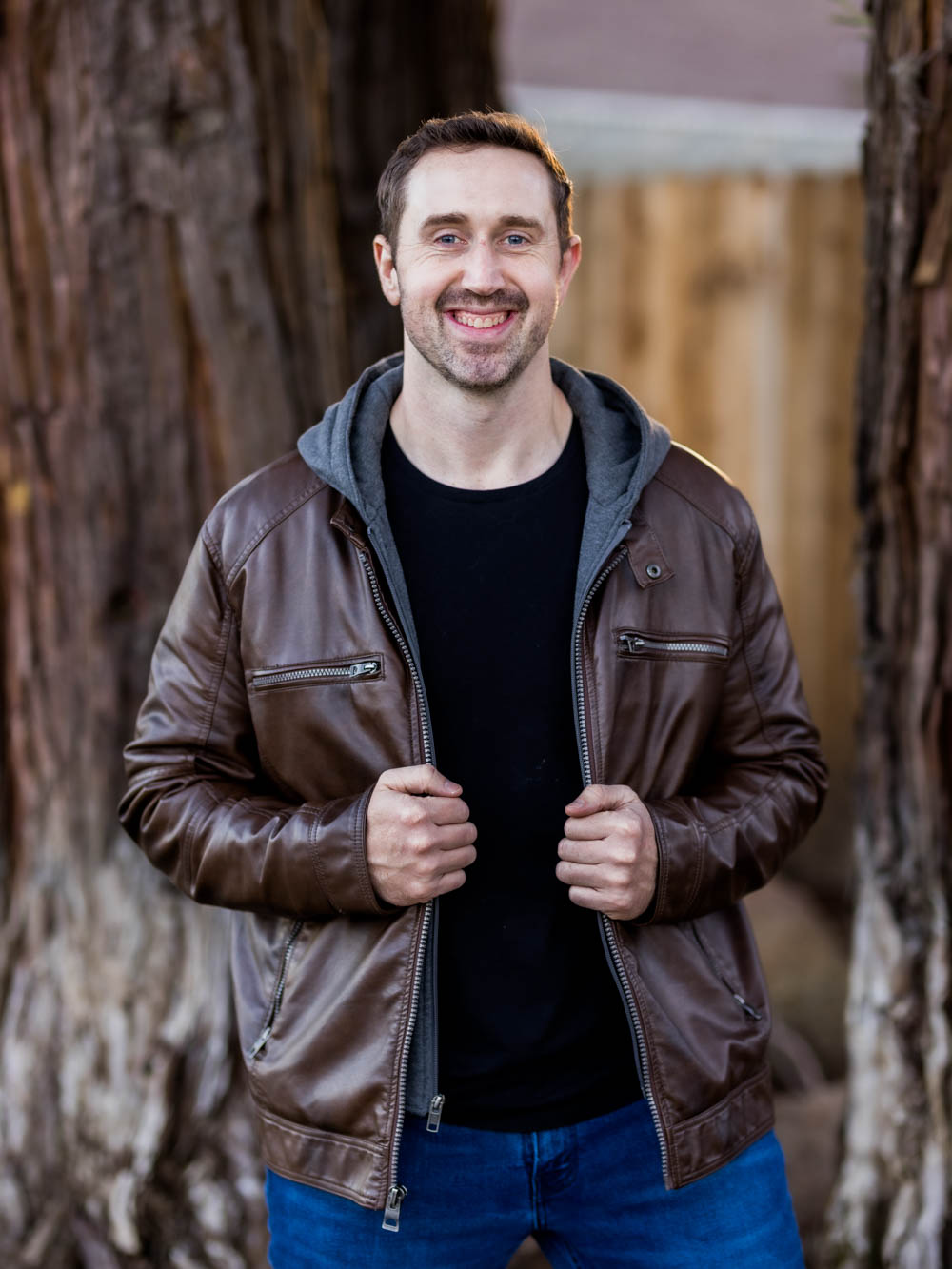 Portrait of Bryan Larcom in front of trees
