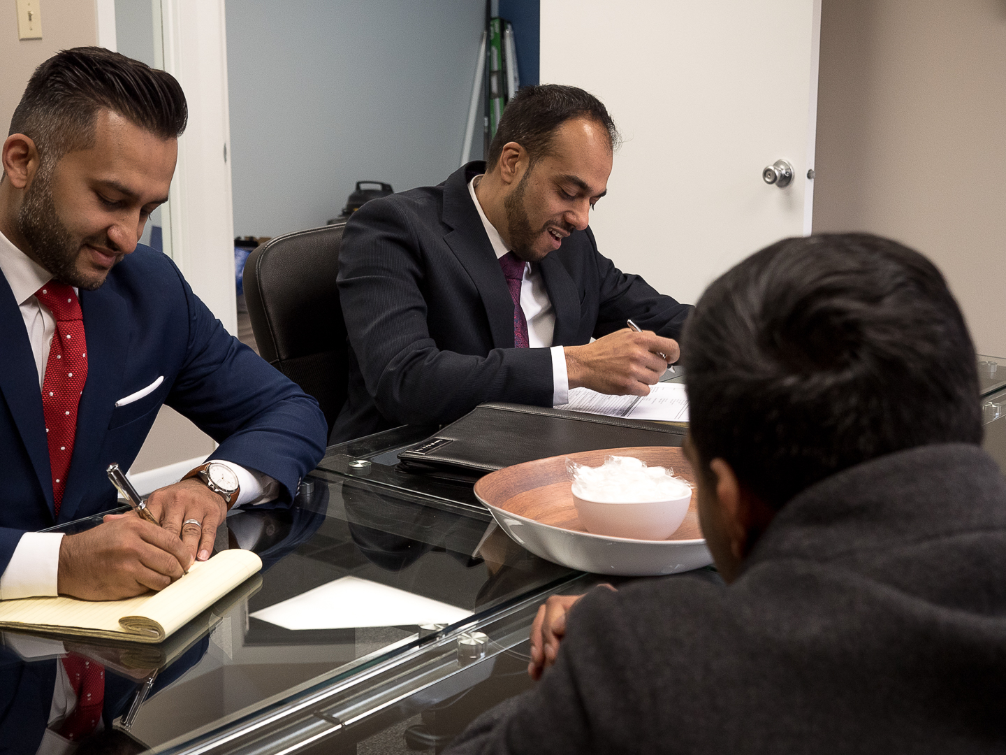 Zara Law Group attorneys meeting with a client in Illinois