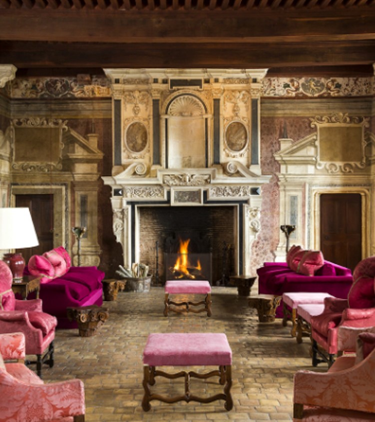 Frescoed salon at Château de Bagnols with period fireplace
