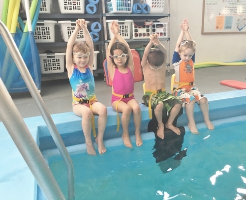 Children learning to dive in the swimming pool at North County Recreation District in Nehalem, Oregon.