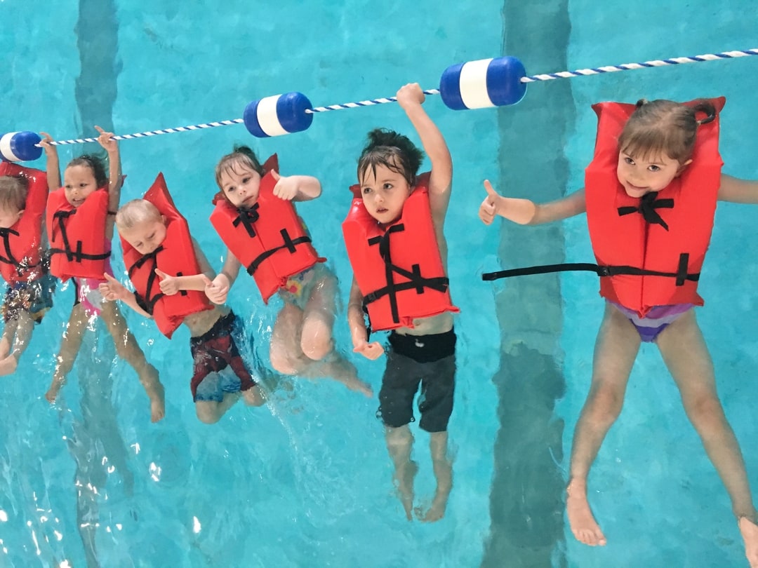 Children learning to swim in the swimming pool at North County Recreation District in Nehalem, Oregon.
