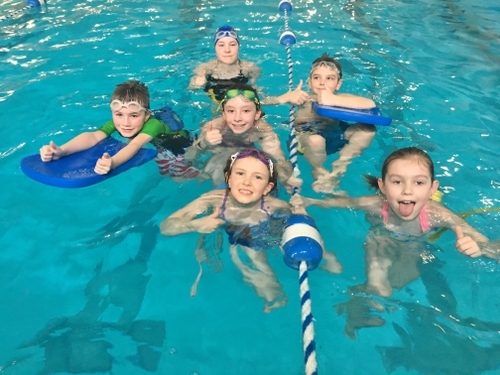 Children swimming at North County Recreation District in Nehalem, Oregon