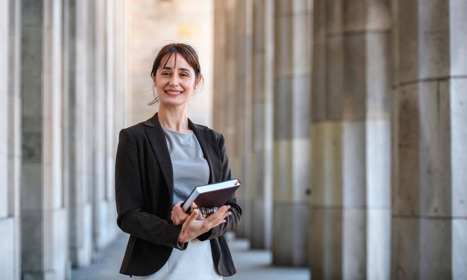 Law student standing outside a courthouse