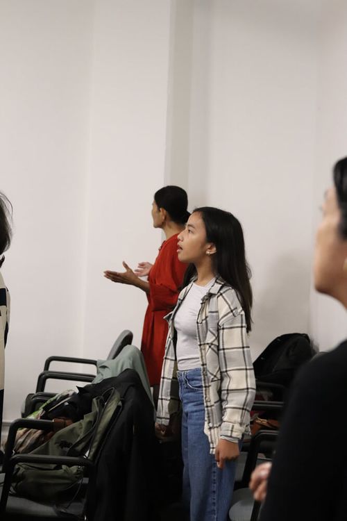 Girl worshipping at The Lighthouse Centre in Brussels