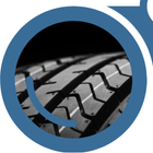 A close-up view of a tire through the left lens of "YardView" blue binoculars.