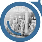 A view of bottles through the left side of "YardView" blue binoculars.