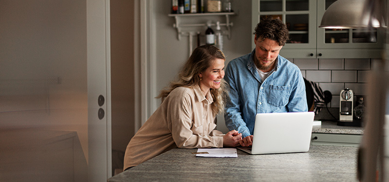 Man and woman looking at laptop